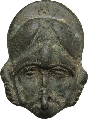 obverse: Bronze decorative element in the shape of helmeted head.  Late roman period or migration period.  37 x 27 mm