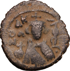 obverse: The Umayyad Caliphate.  Arab-byzantine, pre-reform coinage. AE Fals, Emesa mint, 41-77 H / 661-697 AD