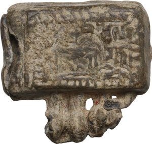 obverse: Islamic (c. 10th or 11th century AD). Amulet lead case. Small box (21.5 x 20.4mm) with a suspension loop on the top and a flap opened on the right to contain in its interior a folded talismanic scroll