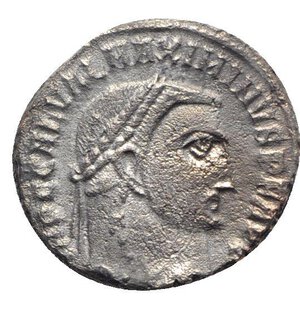 obverse: Maximinus II (310-313). Æ Follis (21mm, 4.98g, 11h). Alexandria, c. 312-3. Laureate head r. R/ Genius standing l., holding bust of Serapis and cornucopia; star/N/palm/Γ//ALE. RIC VI 160b. Roughness, near VF