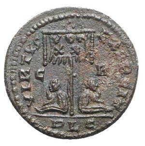 reverse: Crispus (Caesar, 316-326). Æ Follis (19mm, 3.32g, 6h). Lugdunum, AD 321. Laureate, draped and cuirassed bust r. R/ Standard inscribed VOT/XX between two seated captives; C-R/PLG. RIC VII 118. Rare, near VF