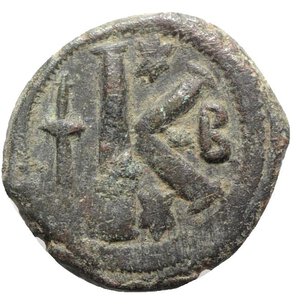 reverse: Justin I (518-527). Æ 20 Nummi (26mm, 8.32g, 6h). Constantinople. Diademed, draped and cuirassed bust r. R/ Large K; long cross to l., star above and below, B to r. Sear 69. Near VF