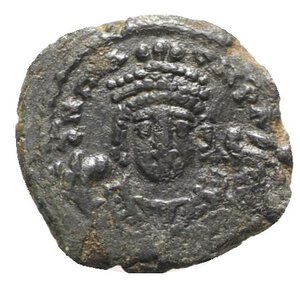 obverse: Maurice Tiberius (582-602). Æ 10 Nummi (18mm, 3.11g, 12h). Antioch, year 15 (596/7). Crowned facing bust, wearing consular robes and holding mappa and eagle sceptre. R/ Large I; cross above, date across fields, THEUP’. Sear 537. About VF