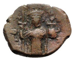 obverse: Constans II (641-668). Æ 40 Nummi (22mm, 3.65g, 6h). Constantinople. Constans standing facing, wearing crown and chlamys, and holding long cross and globus cruciger. R/ Large m. Sear 1000. About VF