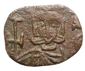 obverse: Constantine V (741-775). Æ 40 Nummi (19mm, 1.72g, 6h). Syracuse, 757-775. Crowned facing busts of Constantine and Leo IV, each wearing chlamys and holding akakia; cross between. R/ Crowned figure of Leo III standing facing, wearing chlamys and holding cross potent. DOC 19; Sear 1569. VF