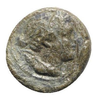 obverse: Northern Lucania, Paestum, after 211 BC. Æ Uncia (13.5mm, 2.18g, 12h). Wreathed head of Demeter r.; pellet behind. R/ Grain ear; caduceus and pellet to l. Crawford 7/4; HNItaly 1204. Rare, green patina, Good Fine