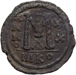 reverse: Justinian I (527-565).. AE Follis, Nicomedia mint