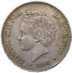 obverse: SPAGNA. Alfonso XIII. 5 pesetas 1892 (92). AG. Colpo al bordo. BB
