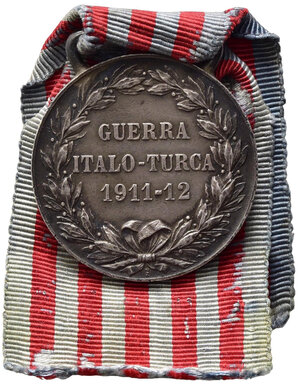 reverse: SAVOIA - Medaglia Guerra Italo Turca 1911-1912. Argento con nastrino originale, con cambretta, produzione Regia zecca. Opus Giorgi. Peso gr. 17,  BB.