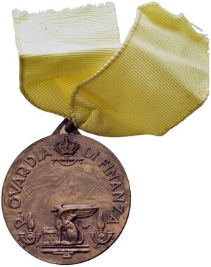 reverse: VENTENNIO FASCISTA - Medaglia Regia Guardia di Finanza, bronzo, diametro 3.2 cm, con anello, nastrino coevo di colore giallo. Opus Morbiducci. Peso gr. 14,45, BB.