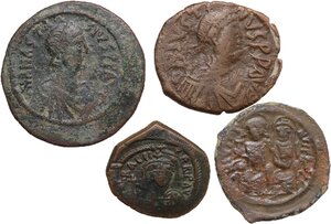 obverse: The Byzantine Empire.. Lot of 4 unclassified AE Denominations, including: Anastasius, Justin I, Justin II, Heraclius