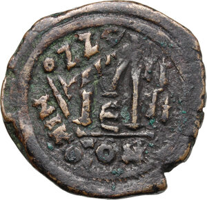 reverse: Heraclius (610-641).. AE Follis, Constantinople mint. Overstruck on a Follis of Justin II, Nicomedia mint