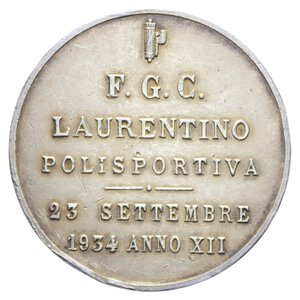 obverse: REGNO D ITALIA MEDAGLIA 1934 XII F.G.C. LAURENTINO POLISPORTIVA AG. 30,14 GR. 40 MM. BB+ (COLPI) (EX ASTA CENTAURO) 