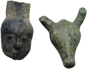 obverse: Celtic World. Lot of two (2) bronze decorative elements in the shape of a human and a bull s head respectively.26x21 mm and 26x14 mm