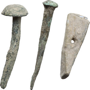 obverse: Roman period. Lot of three (3) bronze and lead items, including two nails and a lead object in the form of a small pickaxe