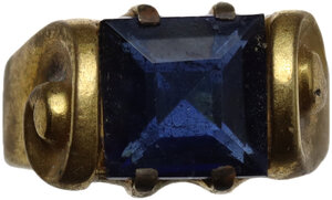 reverse: Post Reinassance, probably 18th century. Gilded ring decorated with two volutes, set with square blue glass gemstone.  16 mm. inner size