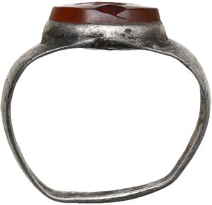 reverse: SILVER RING WITH FISHES  Roman period, c. 3rd-4th century AD.  Small silver foil ring with oval bezel. The set gemstone is an orange carnelian engraved with a representation of two fishes hanging from a fence.  Gemstone: 10x7 mm. Inner diameter of ring: 17 mm
