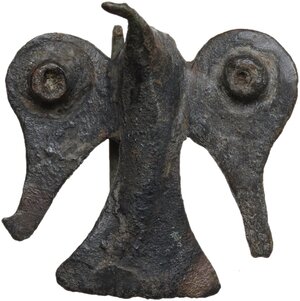 obverse: BIRD SHAPE FIBULA  Roman period, 2nd century AD.  Bronze fibula cast in the form of a bird with long tail and open wings. On each wing is a circular bronze decoration.  30x30 mm