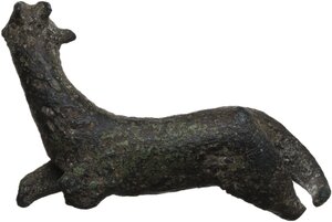 reverse: BRONZE GOAT FIGURINE  Roman period, c. 1st-3rd century AD.  Bronze statuette of a goat, represented lying down and with its head raised.  Dimensions: 35x43 mm