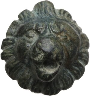 obverse: BRONZE LION S HEAD  Roman period, c. 1st-3rd century AD.  Bronze Roman lion s head in frontal view. Details of the animal s mane and features rendered in detail, mouth and teeth worked open.  Diameter: 26.50 mm