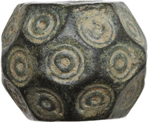 obverse: EARLY ISLAMIC WEIGHT  Early islamic period, c. 9th-12th century AD.  Islamic weight in the shape of a dice with numerous faces.  Diameter: 18 mm