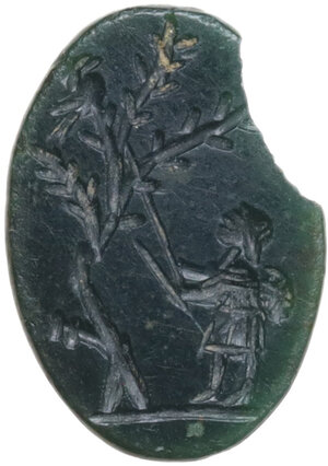 obverse: GREEN JASPER GEMSTONE  Roman period, c. 2nd-3rd century AD.  Oval green jasper gem of truncated cone shape, depicting a probable hunting scene on the flat side. A figure facing left, armed with two long sticks, is probably trying to strike a bird perched on the highest branch of a tree.  Dimensions: 11.5 x 8 mm