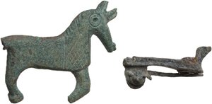 obverse: ROMAN BRONZE BROOCHES  Roman period, c. 3rd-4th century AD.  Lot of two roman bronze fibulae in the form of a quadruped (hoops and lines decoration) and a dove.  Lenghts: 34 and 26 mm