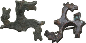 obverse: TWO ROMAN BRONZE SWASTIKA FIBULAE  Roman period, Balkan area, c. 3rd-4th century AD.  Lot of two roman bronze swastika fibulae with the depiction of a stylised horse s head on each arm of the hooked cross.  Dimensions: both 36 mm