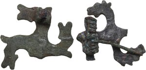 reverse: TWO ROMAN BRONZE SWASTIKA FIBULAE  Roman period, Balkan area, c. 3rd-4th century AD.  Lot of two roman bronze swastika fibulae with the depiction of a stylised horse s head on each arm of the hooked cross.  Dimensions: both 36 mm
