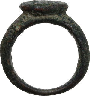 obverse: ROMAN BRONZE RING  Late Roman period, c. 3rd-4th century AD.  Thick bronze ring with engraving at the top.  Dimensions: 25.50 mm., 17.50 mm. inner size