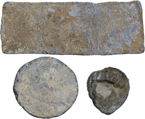 reverse: THREE LEAD ITEMS  Greek and Roman world, c. 3rd century BC-4th century AD.  Lot of three ancient lead items, a bar, a round plaque, a scallop-shell. Letters are visible on the bar.   Dimensions: from 28 to 88 mm