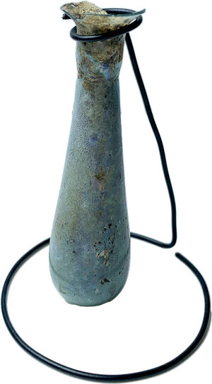 obverse: ROMAN GLASS UNGUENTARIUM  Roman period, 1st-2nd century AD.  Elongated unguentarium with a cut everted lip, a short cylindrical neck with a slight constriction at the base, a pyriform body, a convex bottom.  Height: 88 mm