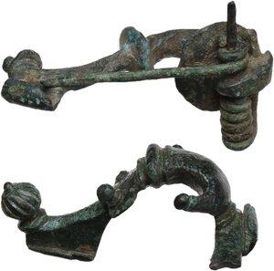 reverse: TWO ROMAN TRUMPET FIBULAE  Roman period, mid 1st-2nd century AD.  Lot of two roman trumpet shaped fibulae, decorated with knobs.  Lenghts: 44 and 42 mm