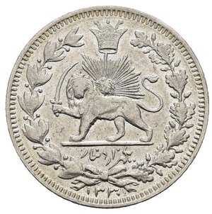 obverse: IRAN – 1000 DINAR 1912 (1330) – AHMAD SHAH QAJAR (1909-1925) - TEHERAN, Al dritto leone con scimitarra andante a s. dietro sole raggiante sopra corona imperiale intorno fronde chiuse in basso da nastro, in esergo data. Al rovescio scritte in parsi intorno fronde chiuse in basso da nastro. Zecca di Teheran. Realizzata in argento (AG) (ø 23.7mm, 4.4g) Conservazione BB/SPL. Riferimenti Krause KM#1038. 