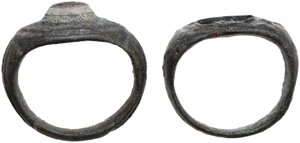 obverse: TWO ROMAN BRONZE RINGS  Roman period, c. 2nd-3rd century AD.   Lot of two (2) bronze rings, one with a lovely iridescent glass paste.  Inner size: both 17 mm