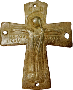 obverse: BYZANTINE INSCRIBED CROSS  Byzantine period, c. 8th-12th century AD.  Byzantine bronze cross with the figure of Christ is a flat relief. Inscription on the horizontal bar below the arms in two rows each side: IΔΕΟVΟ - ΙΔΟVΗΜΗ / COV - THPOC. Holes at each end for fixing.  Dimensions: 67x55 mm