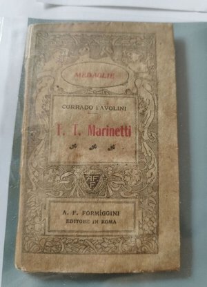 obverse: Futurismo- Libricino di Pavolini su Marinetti contenente xilografia di Prampolini con caricatura di Marinetti