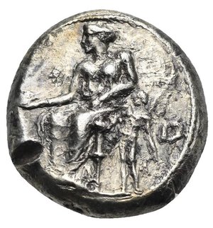 obverse: CILICIA. Nagidos. Circa 420-385 BC. Stater (Silver, 21.16 mm, 10.32 g) Aphrodite draped, seated to left on throne decorated with palmette at each side, holding patera in extended right hand and resting the left arm on her lap; Eros nude standing facing to right, head turned to left, grasping Aphrodite’s left arm with his right hand and holding wreath in his left resting arm. IΣ (retrograde) to lower right. Rev. NAΓIΔEΩN vertical to outer right. Dionysos bearded and nude standing facing, head turned to left, drapery on shoulders, behind his body and on both arms, holding kantharos in his right hand with vine leaf and branch above to left and long thyrsus in his left hand. AN monogram to lower right (not full visible) Casabonne Type 1; Lederer Group 1 (unlisted variety); SNG BN 1 var.; SNG Levante 1 var (legends); SNG von Aulock - ; BMC - ; SNG Paris 1. From artistic dies. Lightly moving strike and minor cut test on obverse, otherwise, Good Very Fine/Extremely Fine. Rare.
From a European collection formed prior to 2005.