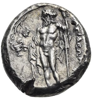 reverse: CILICIA. Nagidos. Circa 420-385 BC. Stater (Silver, 21.16 mm, 10.32 g) Aphrodite draped, seated to left on throne decorated with palmette at each side, holding patera in extended right hand and resting the left arm on her lap; Eros nude standing facing to right, head turned to left, grasping Aphrodite’s left arm with his right hand and holding wreath in his left resting arm. IΣ (retrograde) to lower right. Rev. NAΓIΔEΩN vertical to outer right. Dionysos bearded and nude standing facing, head turned to left, drapery on shoulders, behind his body and on both arms, holding kantharos in his right hand with vine leaf and branch above to left and long thyrsus in his left hand. AN monogram to lower right (not full visible) Casabonne Type 1; Lederer Group 1 (unlisted variety); SNG BN 1 var.; SNG Levante 1 var (legends); SNG von Aulock - ; BMC - ; SNG Paris 1. From artistic dies. Lightly moving strike and minor cut test on obverse, otherwise, Good Very Fine/Extremely Fine. Rare.
From a European collection formed prior to 2005.