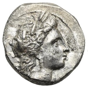 obverse: LUCANIA. Metapontum. Circa 330-290 BC. Nomos (Silver, 21.0mm, 7.72 g). Head of Demeter to right, wearing triple pendant earring and a grain wreath. Rev. META Barley ear of seven grains with leaf to right; above leaf, Nike standing to left holding wreath with both hands; to left, at base of barley ear, ΛΥ. Johnston Class C, 9.1; HN Italy 1591. SNG ANS 496-498. SNG Copenhagen 1225. SNG Lockett 423. HGC 1, 1063. Some corrosion and deposits, otherwise, good Very Fine.
