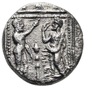 reverse: CILICIA. Tarsos. Tarkumuwa (Datames) satrap of Cilicia and Cappadocia, 384-361/0 BC. Stater (Silver, 20.73 mm, 9.74 g) circa 370 BC. B’LTRZ in Aramaic to left. Baaltars bare torso seated facing on throne slightly to right, holding bunch of grapes and grain ear in the left hand and resting the right hand on long scepter surmounted by eagle behind his right shoulder; thymiaterion (incense burner) in field to right, all within crenellated circle. Rev. ‘TRDMW’ vertical in Aramaic. Ana bearded standing nude to right, the left leg onward, raising the right arm and resting the left, face to face with Datames bearded, wearing clamys, the right arm raised and bent, resting the left on his hip, thymiaterion between them, all within square dotted frame. Casabonne Series 3; SNG France 290; SNG Levante 84; SNG von Aulock 5945. Rough surface and metal horns, otherwise, Nearly Very Fine.
From a European collection formed prior to 2005.