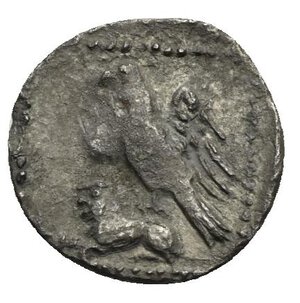 reverse: CILICIA. Uncertain mint. 4th Century BC. Obol (Silver, 11.45 mm, 0.50 g). Youthful male head to left, probably Triptolemos, wearing wreath of grain ears; border of dots. Rev.  Eagle standing left, with spread wings, on back of lion seated left; all  within a dotted square. SNG France 2, Cilicie, 474. SNG Switzerland I, Levante-Cilicia, 230. Dark patina. Near Very Fine.

