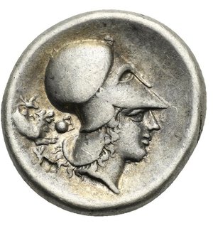 reverse: CORINTHIA. Corinth. Circa 350-300 BC. Stater (Silver, 21.30 mm, 8.44 g). Pegasus flying to left, below, Ϙ. Rev. Helmeted head of Athena right, wearing Corinthian helmet; behind head, forepart of chimera, pellet, K and reverted E. Calciati, I, 245, 365. Ravel 985. BCD Corinth-unlisted. Light toned with pleasing iridescent gold patina. Good Very Fine.