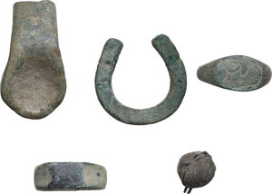 reverse: FIVE ROMAN ITEMS  Roman period, c. 1st-5th century AD.  Lot of five roman bronze items, comprehending a miniaturistic horseshoe, a bell, a lion s paw and two rings, one with a dove engraved.  Dimensions: from 38 to 17 mm
