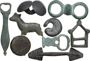 obverse: LOT OF NINE ANCIENT ITEMS  Roman to early Medieval period, c. 1st-10th century AD.  Variegated lot of nine ancient bronze items, from the Roman to the Medieval period, comprehending parts of fibulae, a double button and other objects to identify.  Dimensions: from 59 to 20 mm