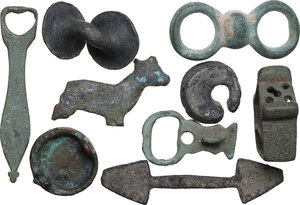 reverse: LOT OF NINE ANCIENT ITEMS  Roman to early Medieval period, c. 1st-10th century AD.  Variegated lot of nine ancient bronze items, from the Roman to the Medieval period, comprehending parts of fibulae, a double button and other objects to identify.  Dimensions: from 59 to 20 mm