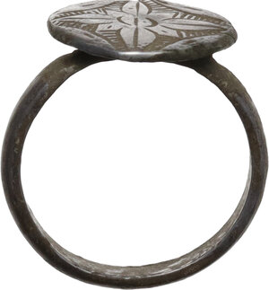obverse: ANCIENT SILVER RING  Early Medieval period, c. 7th-12th century AD.  Ancient silver ring with ovoid bezel and engraved floral decoration.  Dimensions: 22x21 mm.  Inner size: 17.5 mm
