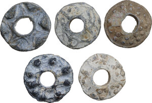 obverse: FIVE LEAD SPINDLE WHORLS  Medieval England, c. 10th-13th century AD.  Lot of five lead Medieval spindle whorls from England, decorated with dots and triangles in relief.  Dimensions: from 31 to 29 mm