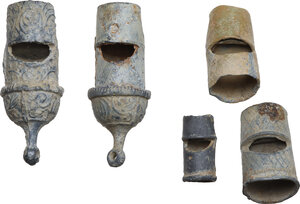 obverse: LEAD WHISTLES  From Roman to Modern times.  Lot of two complete whistles and three lead whistle parts, decorated with phytomorphic and geometric motifs.  Dimensions: from 41 to 17 mm
