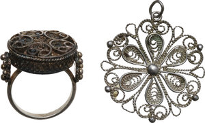 obverse: ANTIQUE SILVER PARURE  Bulgarian craftmanship, c. 19th-20th century AD.  Lot consisting of silver filigree ring and pendant, Bulgarian craftsmanship.  Dimensions: 24x22 and 31x29 mm.  Inner size: 16 mm
